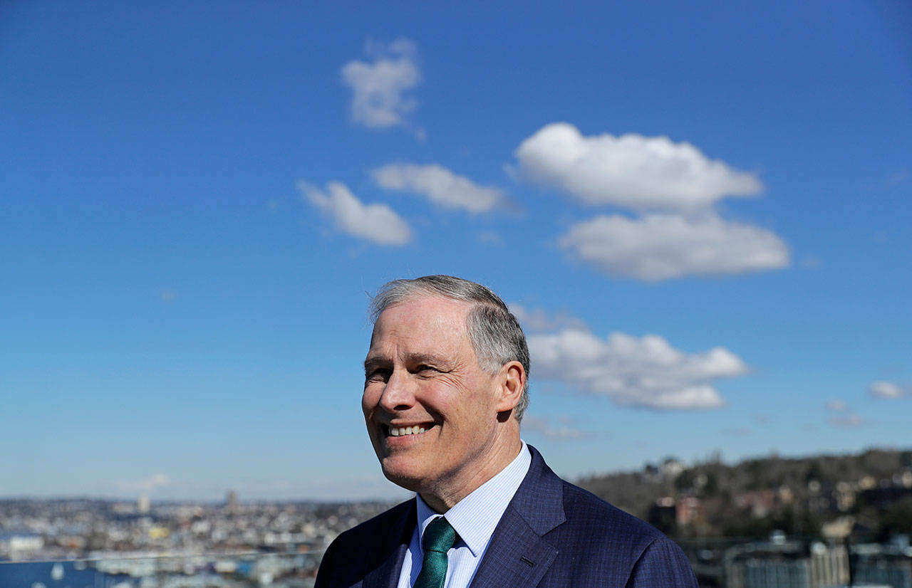 Gov. Jay Inslee stands on an outdoor patio Friday as he takes part in media interviews in Seattle the day he announced he will seek the 2020 Democratic presidential nomination. (Ted S. Warren/The Associated Press)