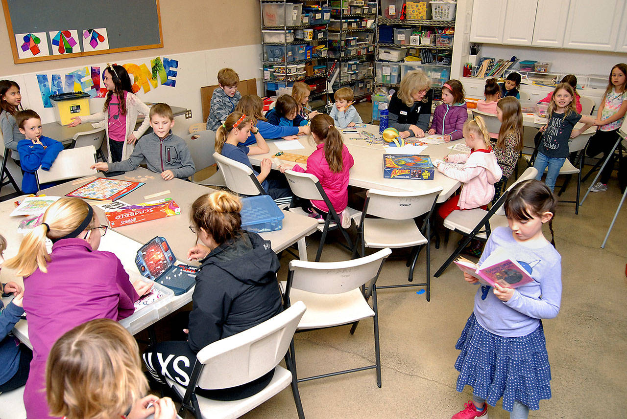 Youngsters in the Clallam County YMCA’s “After the Bell” activities program take part in after-school actvities Tuesday at the Y in Port Angeles. (Keith Thorpe/Peninsula Daily News)