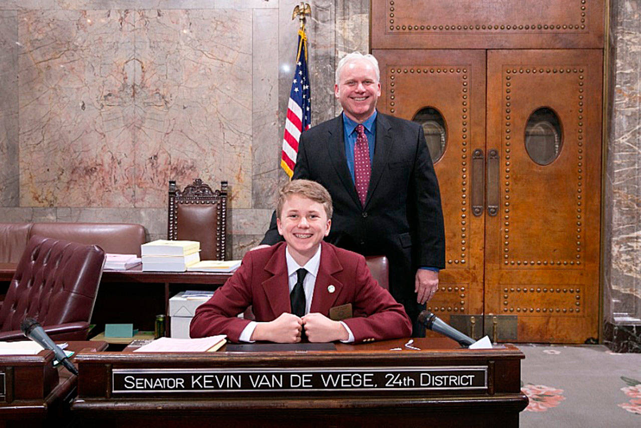 Jackson Van De Wege, front, was a page for his father, state Sen. Kevin Van De Wege, back, in the state Senate this month. (Washington State Senate)