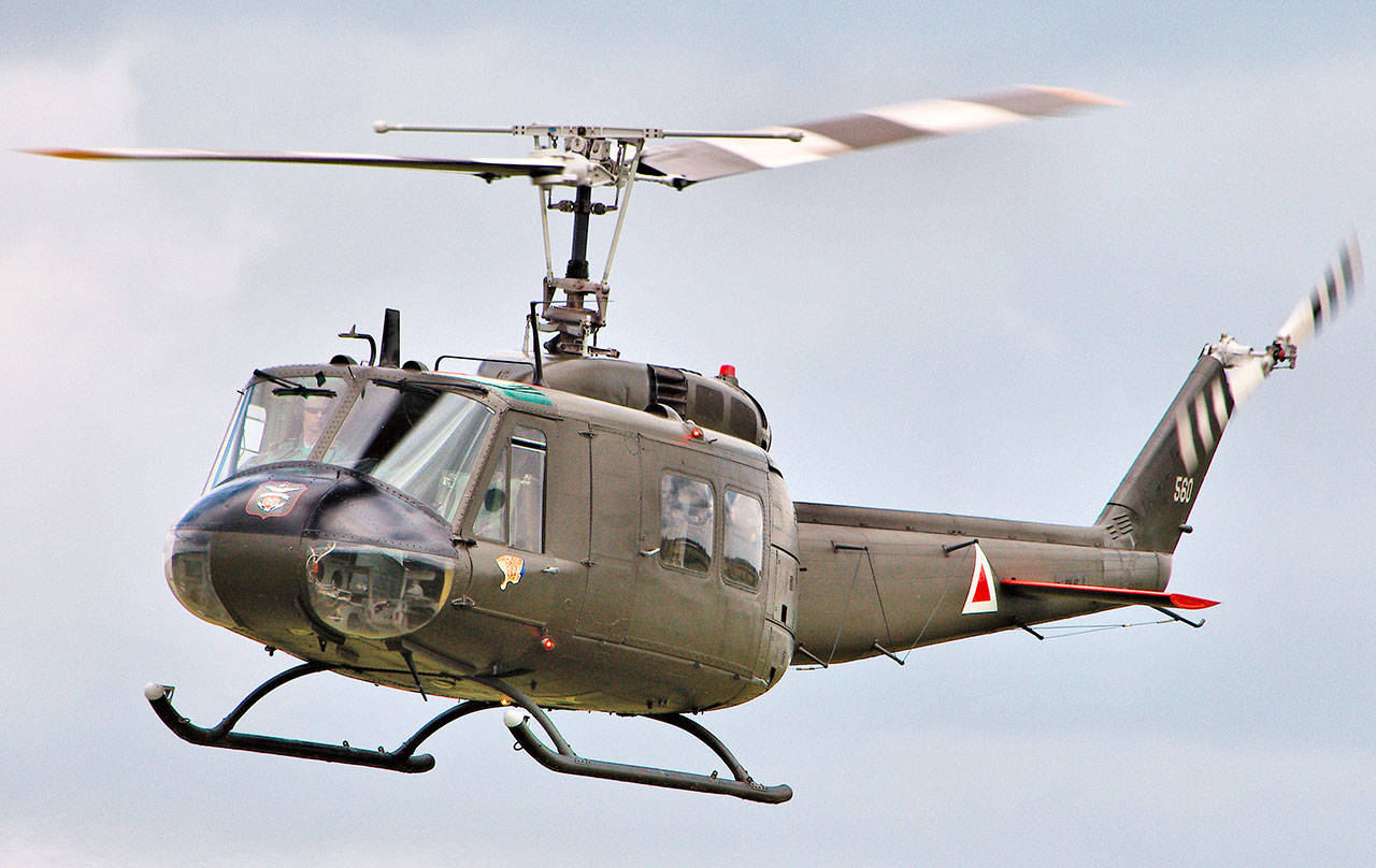 Shown is a military version of the Bell UH-1 Huey which crashed west of Lake Crescent on Friday. (Wikimedia Commons)