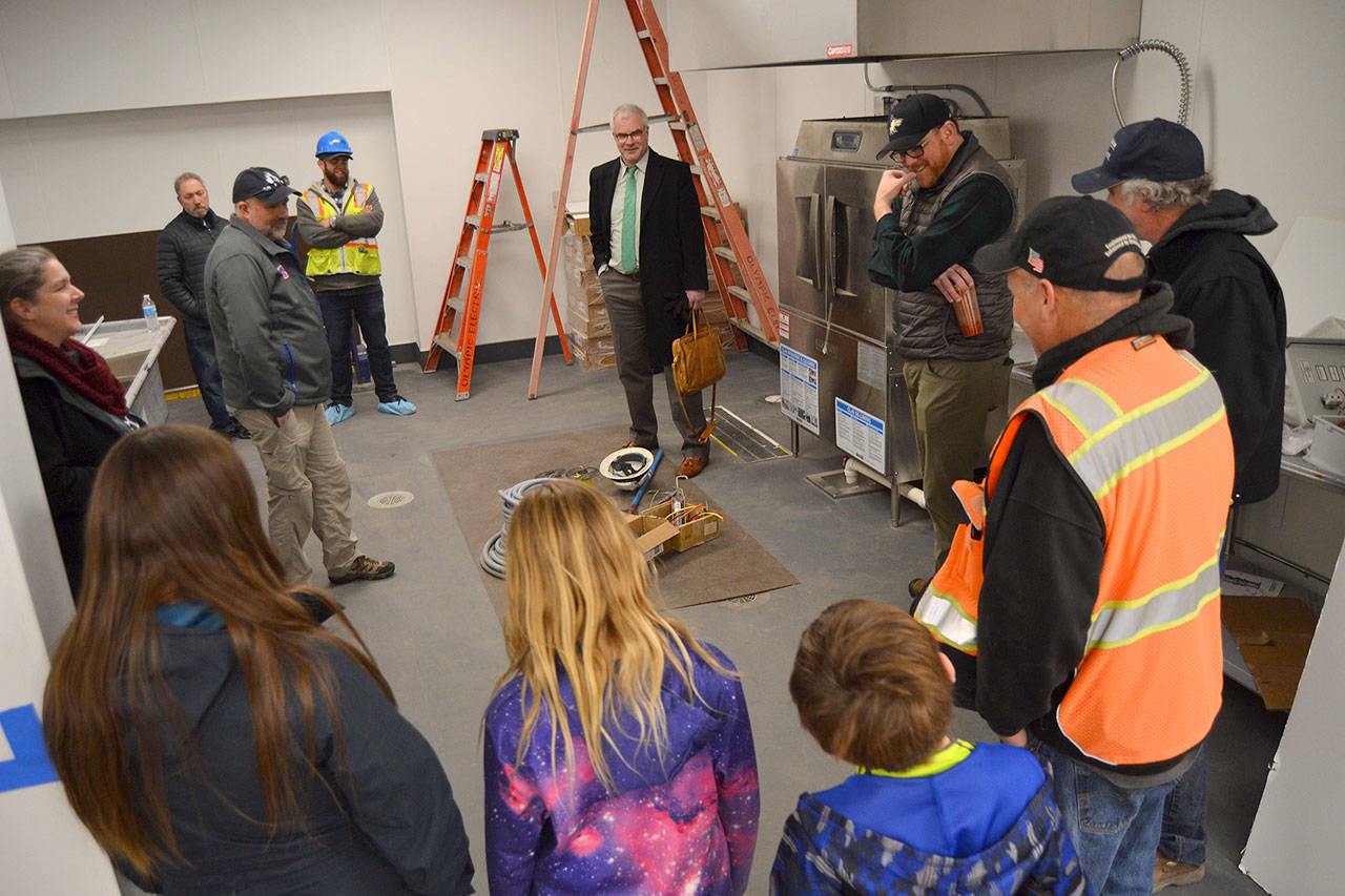 Construction officials, Sequim School District staff and School Board members and their family tour the inside of the district’s new central kitchen as it’s being readied for a tentative opening in early April to serve 900-plus meals daily. (Matthew Nash/Olympic Peninsula News Group)