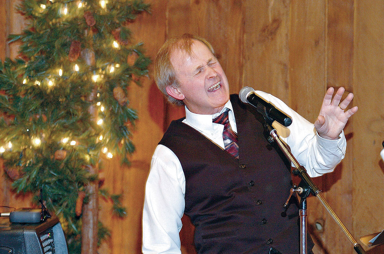 Charlie Ferris sings at the Bushwhacker restaurant in Port Angeles during a December 2009 performance. (Peninsula Daily News)