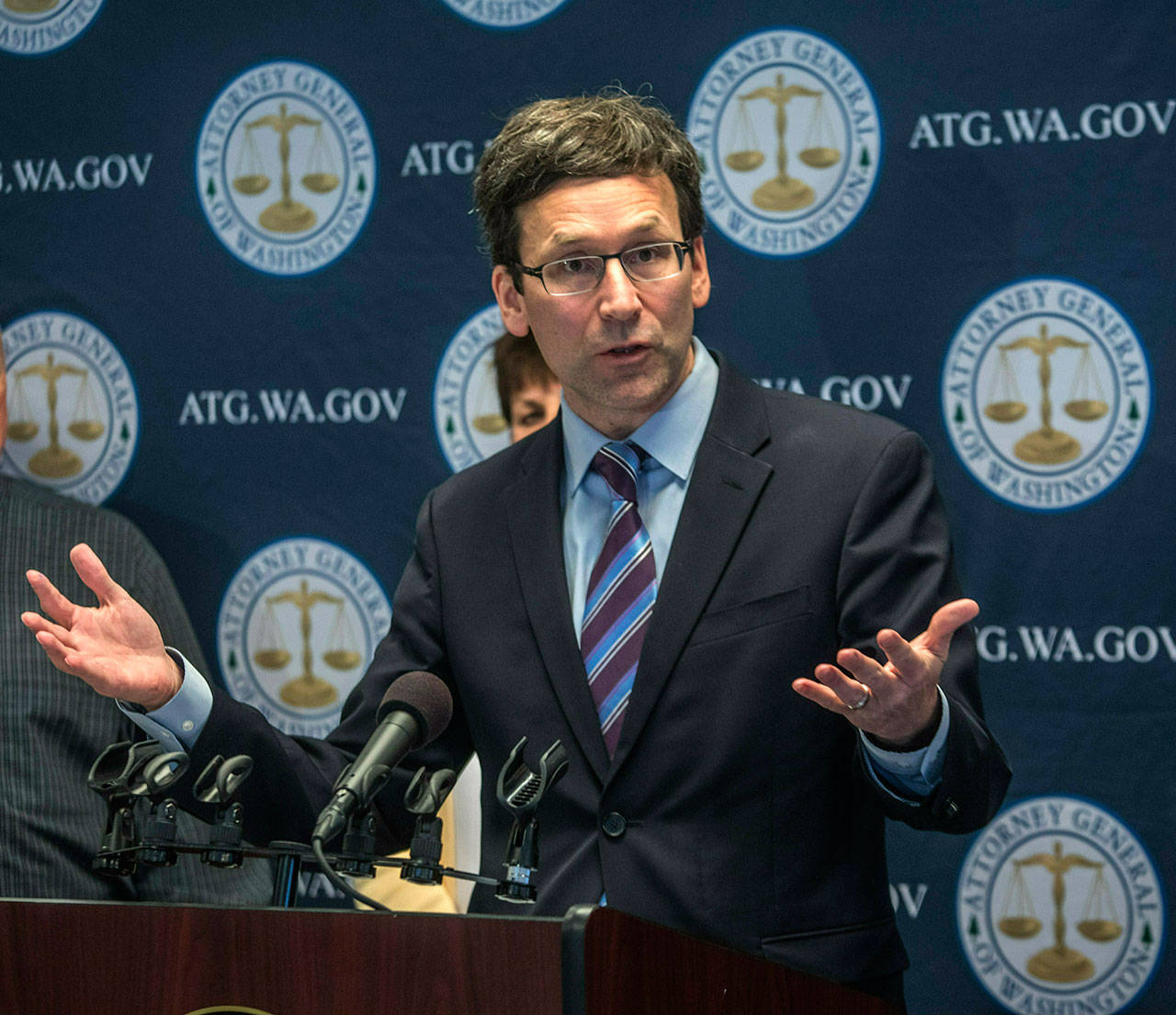 (Steve Ringman/The Seattle Times via The Associated Press)                                State Attorney General Bob Ferguson announces a major lawsuit against drug distributors related to Washington’s opioid epidemic Tuesday in Seattle.