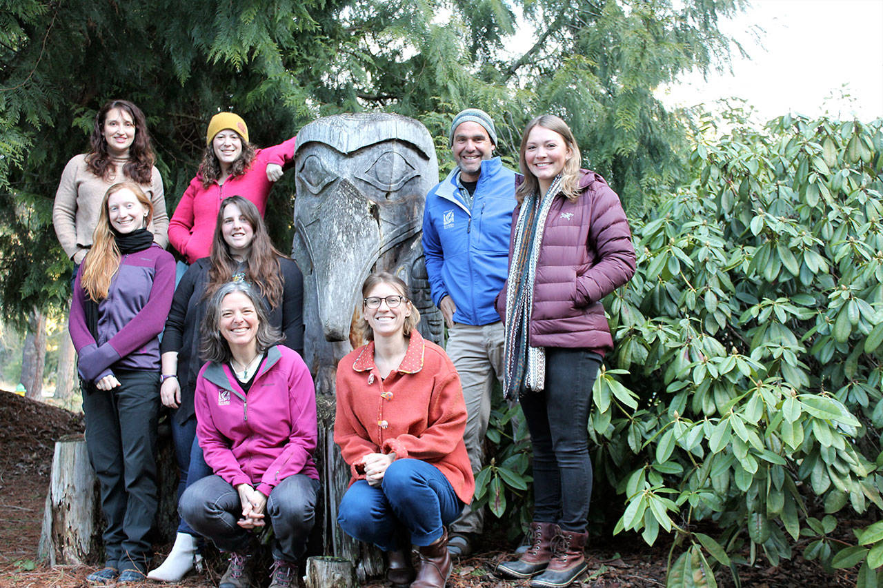 North Olympic Salmon Coalition staff members are pictured from left, Nicole O’Hara, Olivia Vito, Sarah Albert, Sarah Doyle, Rebecca Benjamin, Hannah Seligmann, Kevin Long and Bre Harris. The coalition will receive the North Olympic Land Trust’s Out Standing in the Field Award. (Alana Linderoth/North Olympic Land Trust)