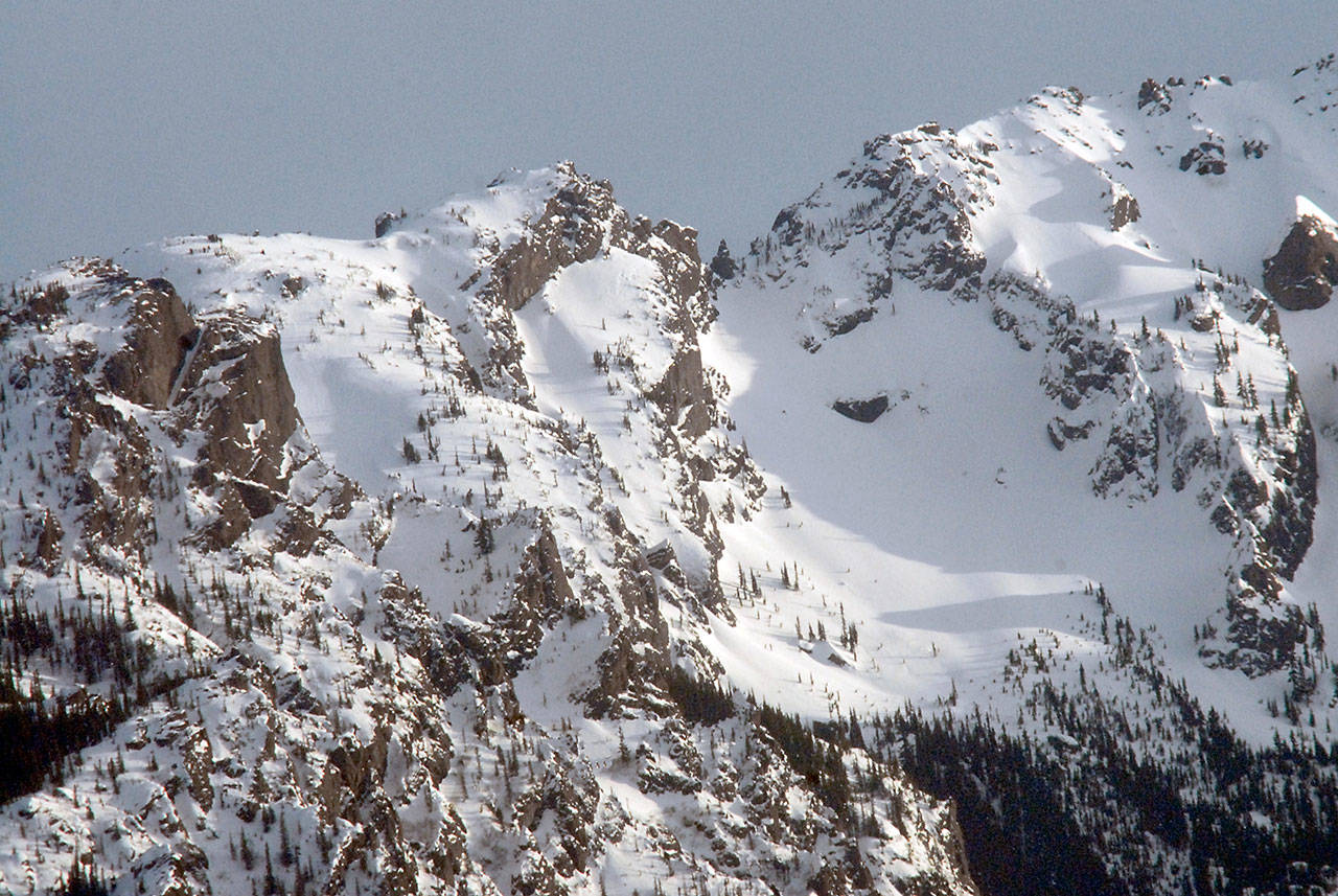 A mantle of snow covers a portion of Klahhane Ridge as seen from Port Angeles. (Keith Thorpe/Peninsula Daily News)