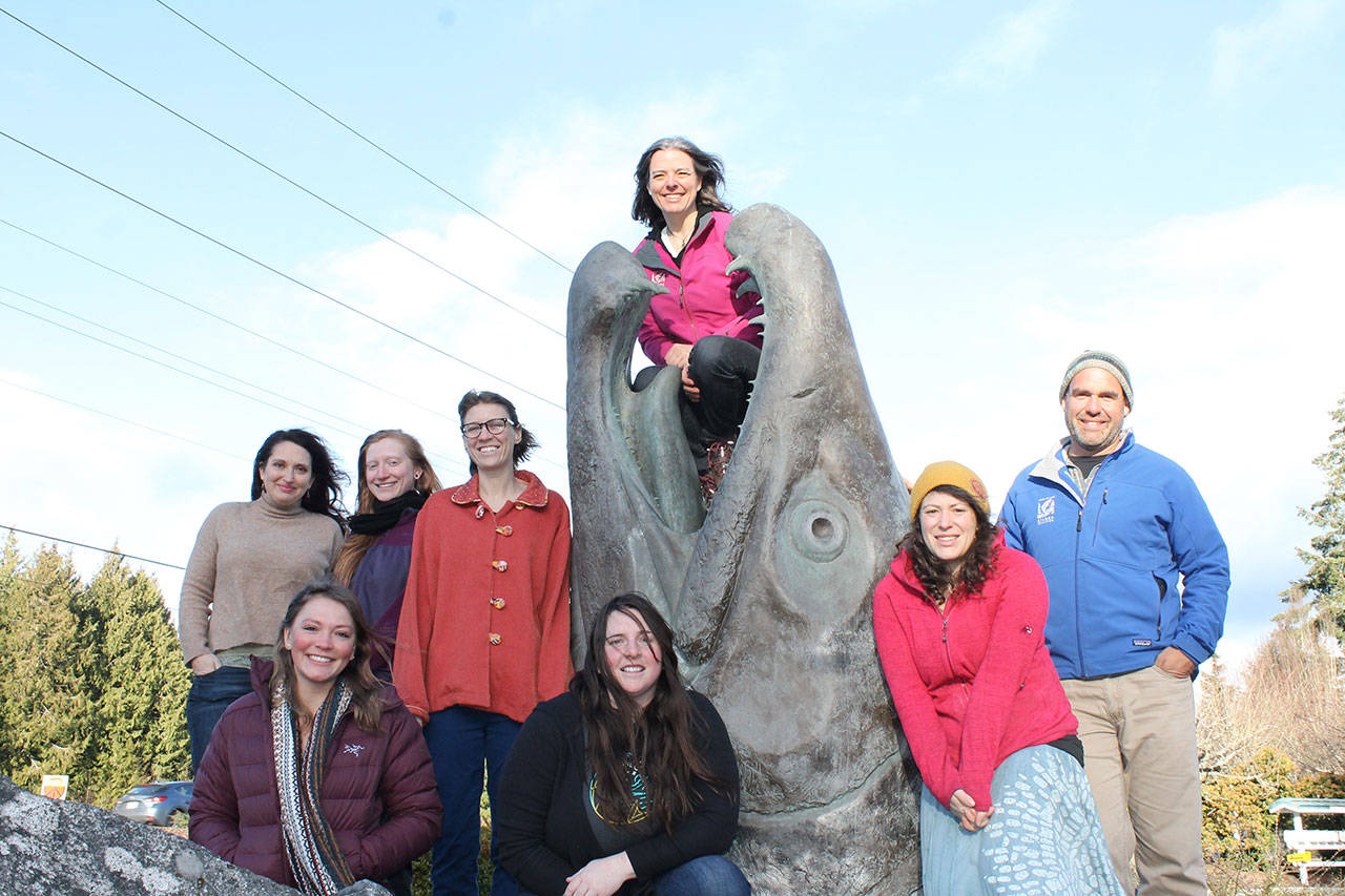 Staff members of the North Olympic Salmon Coalition, winners of the North Olympic Land Trust’s 2019 Out Standing in the Field Award, include, from left, Nicole O’Hara, Bre Harris, Olivia Vito, Hannah Seligmann, Sarah Doyle, Rebecca Benjamin, Sarah Albert and Kevin Long. (Alana Linderoth/North Olympic Land Trust)