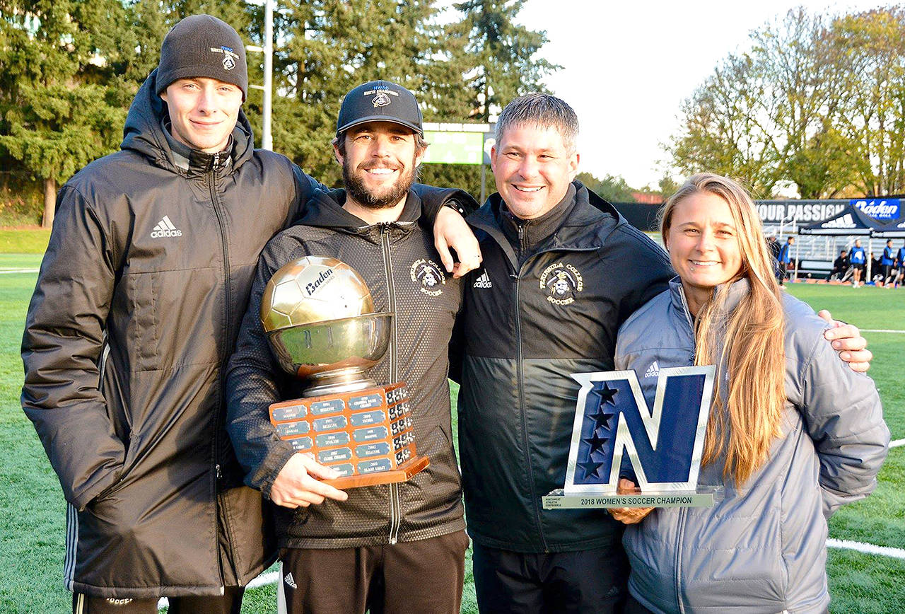 Jay Cline Peninsula College women’s soccer head coach Kanyon Anderson, second from left, was voted NWAC Coach of the Year. He is pictured celebrating the Pirates’ record fourth NWAC soccer championship with from left, Peninsula men’s head coach Jake Huges and women’s assistants Andrew Cooper and Jordyn Shaffer.