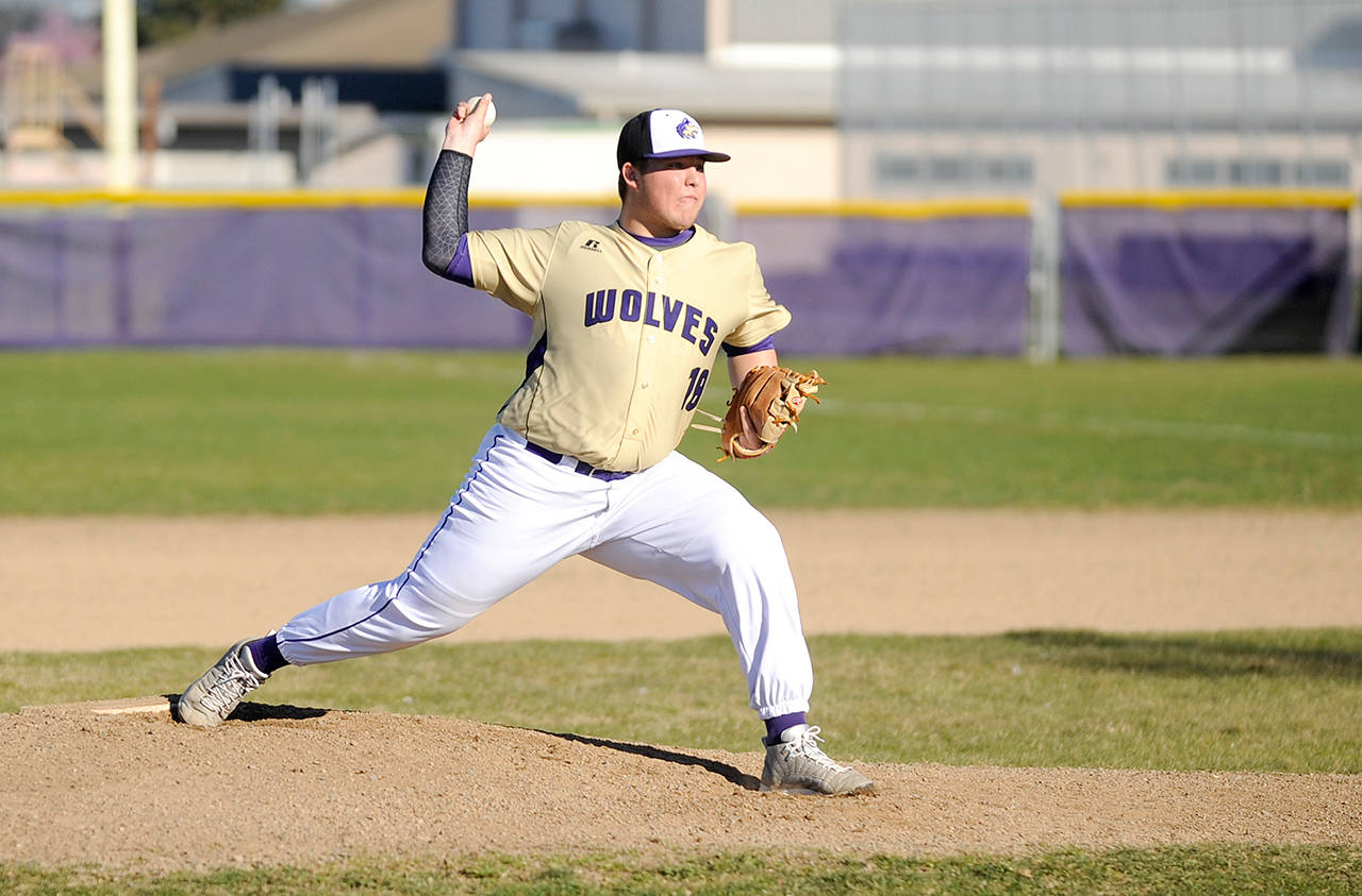 Michael Dashiell/Olympic Peninsula News Group Sequim’s Johnnie Young pitched a complete game, striking out 10, in the Wolves’ 10-1 win over North Mason.