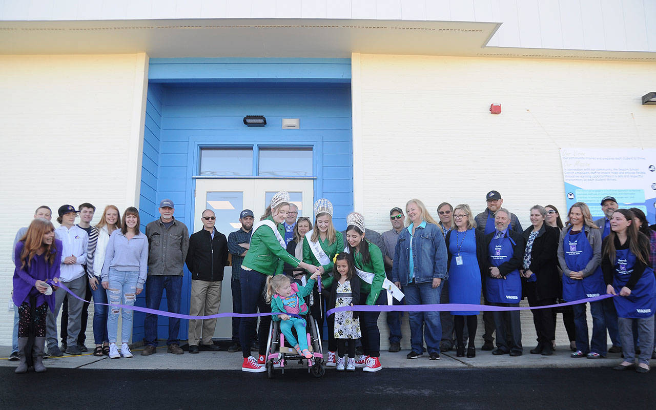 School representatives, community members and others celebrate the official opening of the Sequim School District’s new central kitchen with a ribbon-cutting. (Michael Dashiell/Olympic Peninsula News Group)