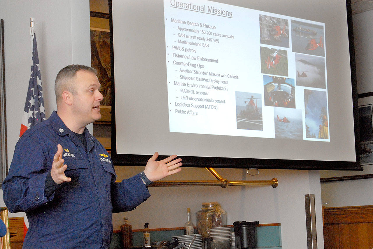 Cmdr. Scott Jackson, commanding officer of U.S. Coast Guard Air Station/Sector Field Office Port Angeles, speaks about the role of the Coast Guard during a Thursday luncheon with the Kiwanis Club of Port Angeles. (Keith Thorpe/Peninsula Daily News)