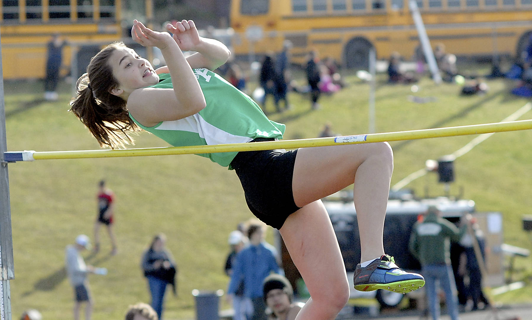 Keith Thorpe/Peninsula Daily News Port Angeles freshman Eve Burke won the girls high jump by clearing 4-feet, 10 inches during the Retro Flying A Meet at Port Angeles High School on Thursday.