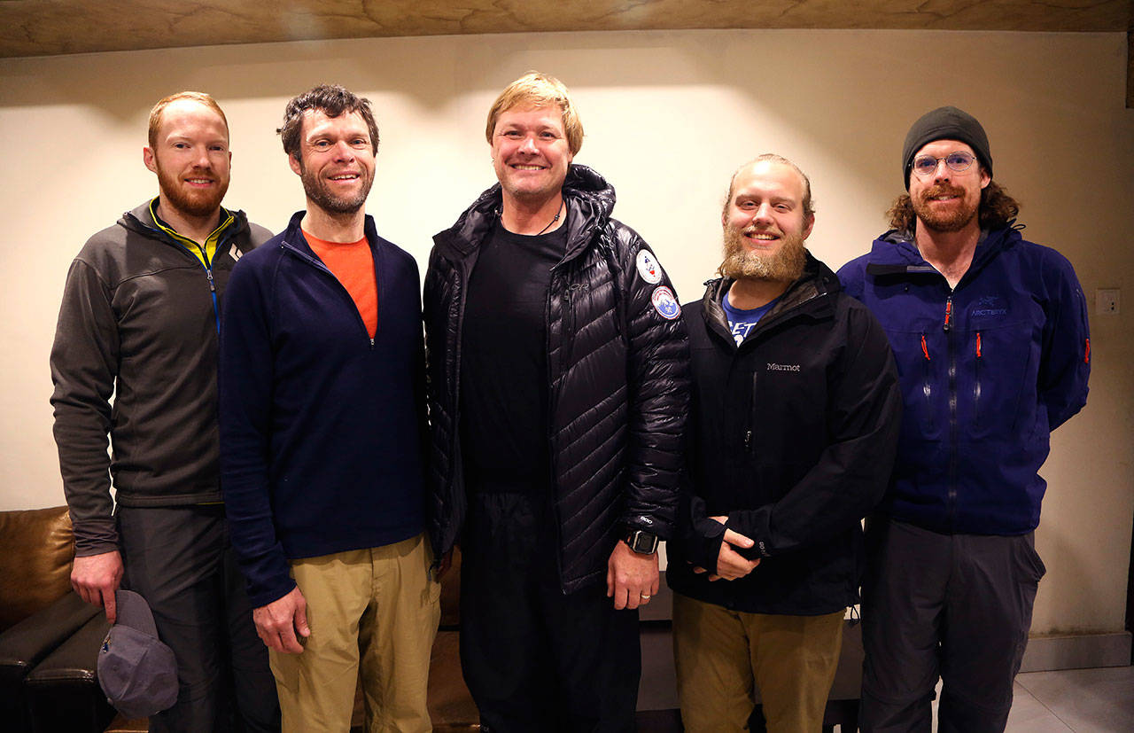 Professor John All, center, of Western Washington University, and his team pose for the photograph at a hotel before leaving for Everest region, in Kathmandu, Nepal, March 27. (AP Photo/Niranjan Shrestha)