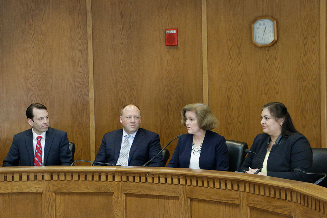 Senate Majority Leader Andy Billig, left, and Sens. David Frockt, Christine Rolfes and Manka Dhingra discuss a two-year budget proposal in Olympia on Friday. (Rachel La Corte/The Associated Press)