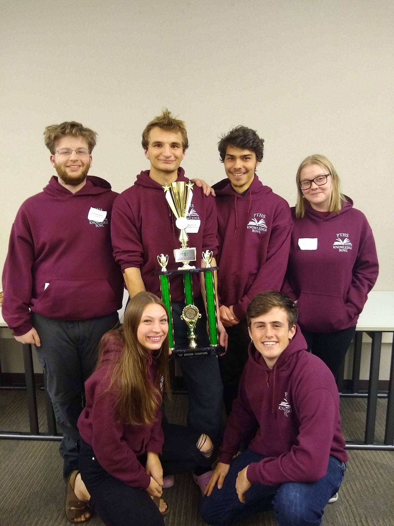Pictured with their trophy are team members, back row, from left, Raphael Bakin, Gabe Petrick, Lou Babik and Karen Absher, and, front row, from left, Jules Short and Henry Stier. Not pictured are coaches Ben and Julianne Dow.