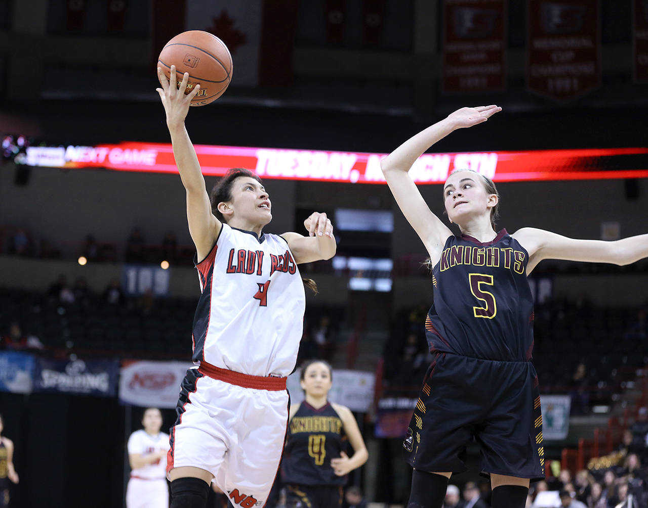 Chris Johnson/for Peninsula Daily News Neah Bays Laila Greene, left, shoots while defended by Sunnyside Christians Sydney Banks. Greene has been picked to the Peninsula Daily News All-Peninsula girls basketball team.