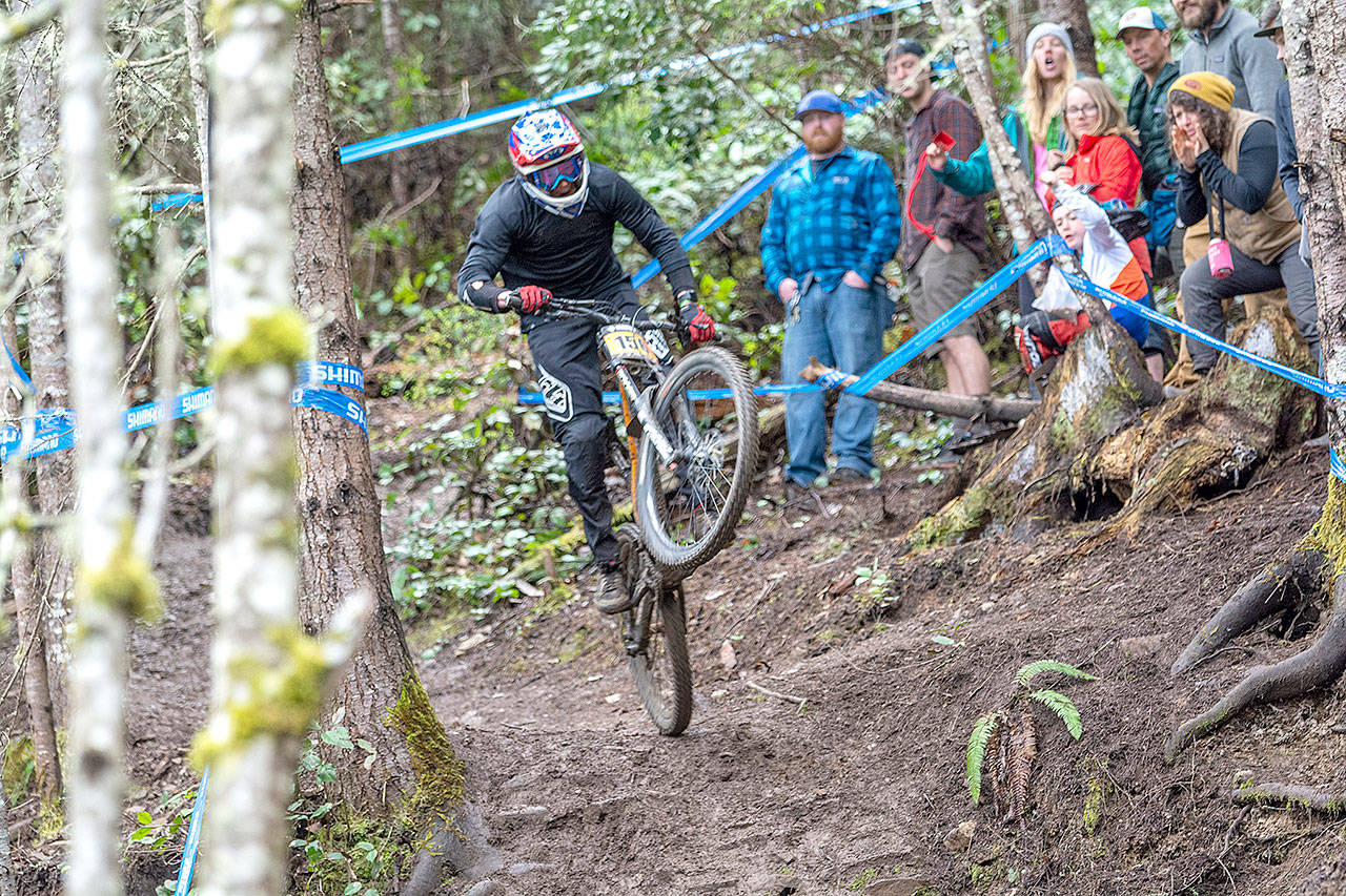 Alex Matthew of Delta, B.C., competes at the Northwest Cup at Dry Hill in Port Angeles on Sunday. More than 500 mountain bikers from across the U.S. and Canada were in Port Angeles this weekend to compete in the major downhill event. For full Northwest Cup results, look online at www.peninsuladailynews.com Monday evening or look in Tuesday’s sports section.                                (Jesse Major/Peninsula Daily News)