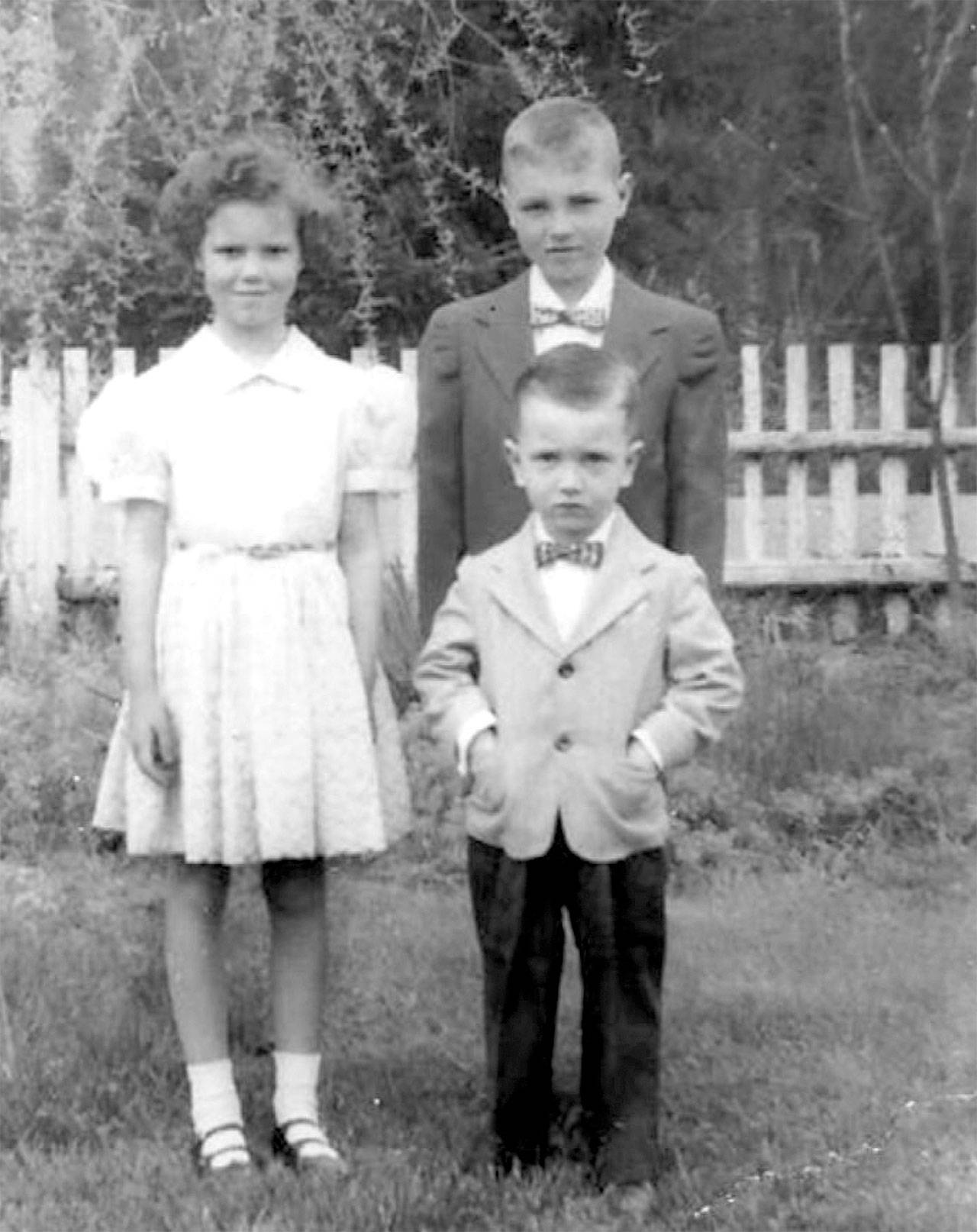 A young Greg Reynolds poses in front of his older siblings for an Easter photo.
