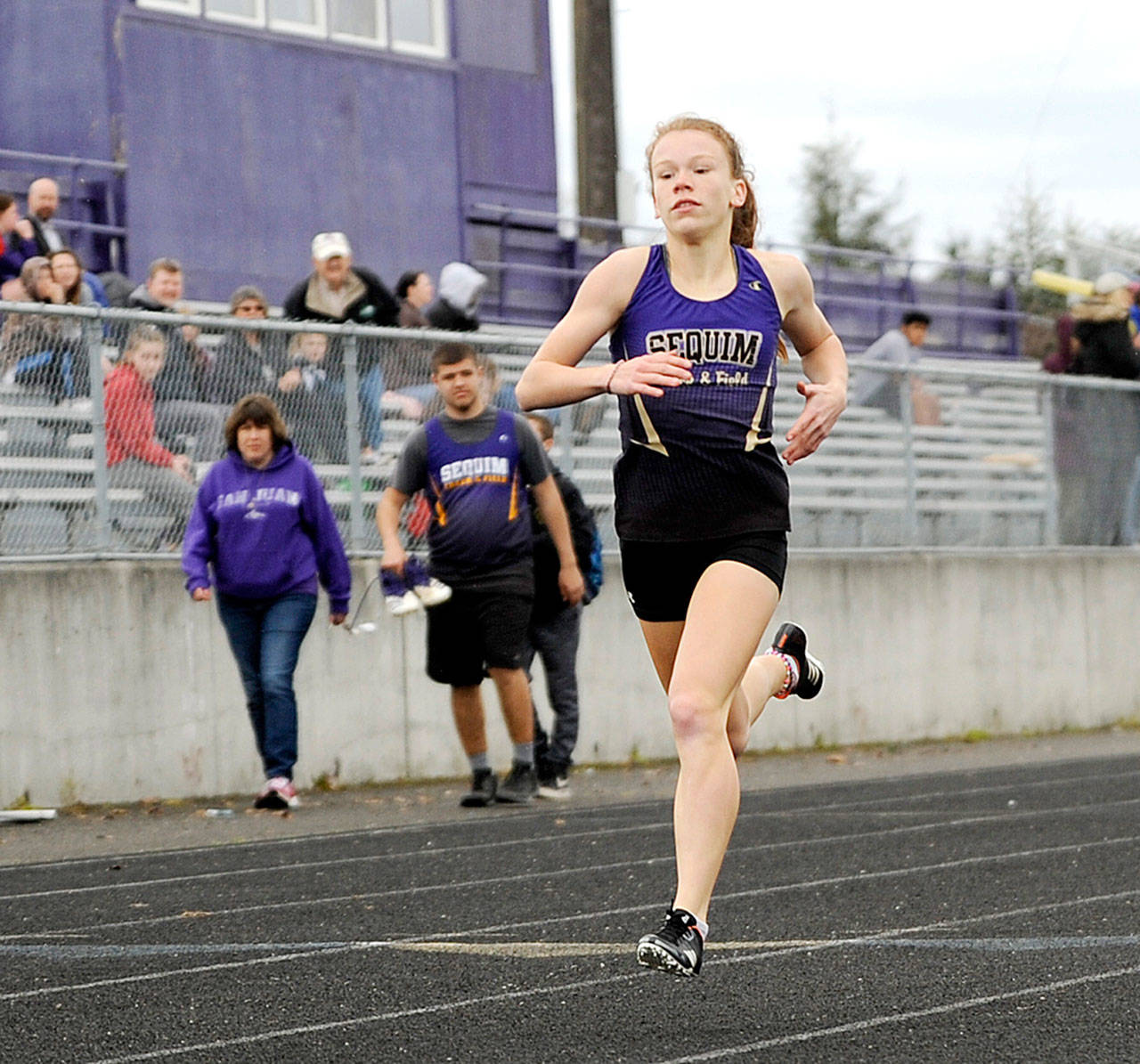 Michael Dashiell/Olympic Peninsula News Group Sequims Riley Pyeatt won three individual events  the 100-, 200- and 400-meter runs  at Sequims home meet Thursday with Port Townsend and Olympic. Pyeatt was also part of a first-place 4x200 relay team.