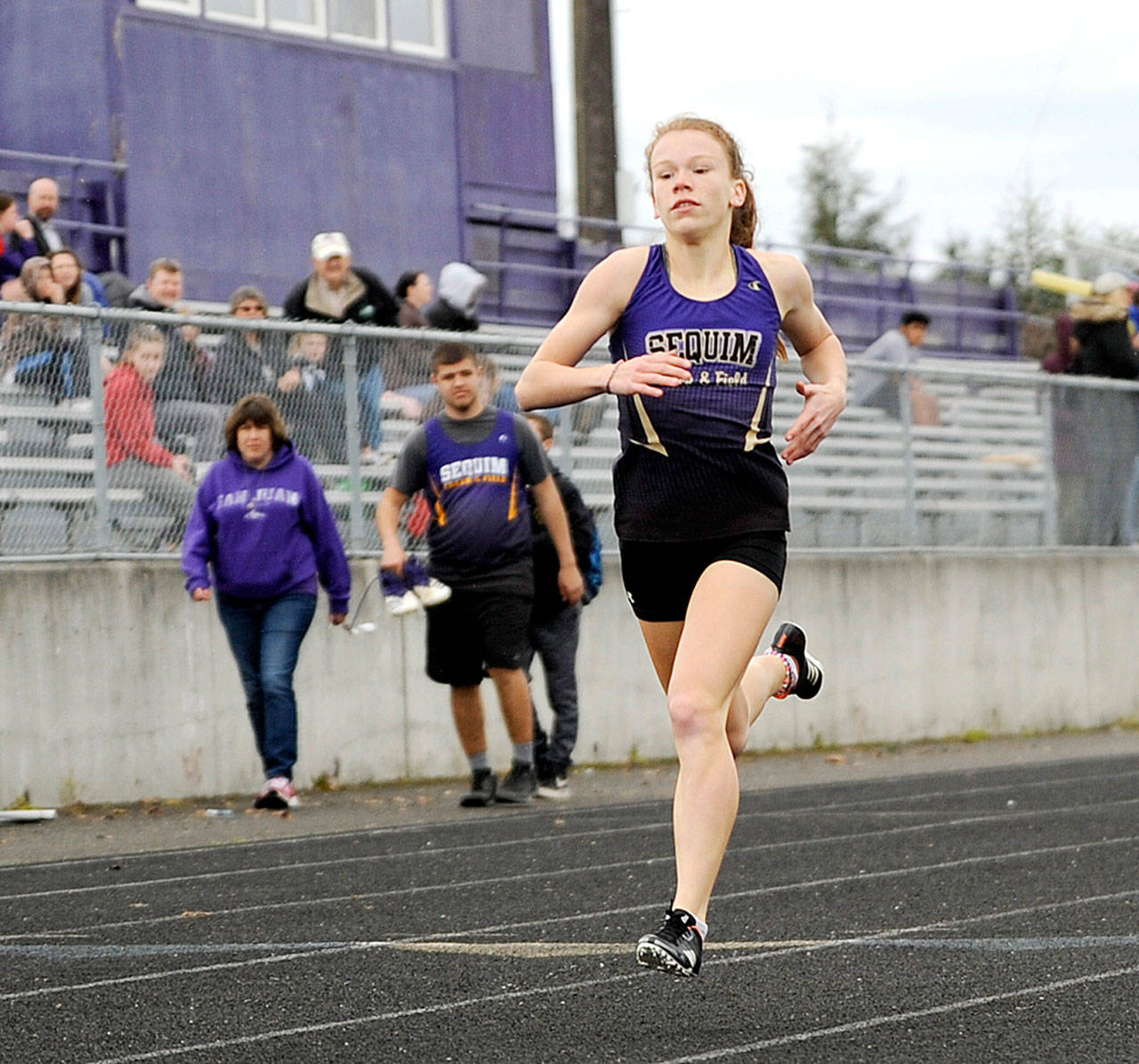 Michael Dashiell/Olympic Peninsula News Group Sequim’s Riley Pyeatt won three individual events — the 100-, 200- and 400-meter runs — at Sequim’s home meet Thursday with Port Townsend and Olympic. Pyeatt was also part of a first-place 4x200 relay team.