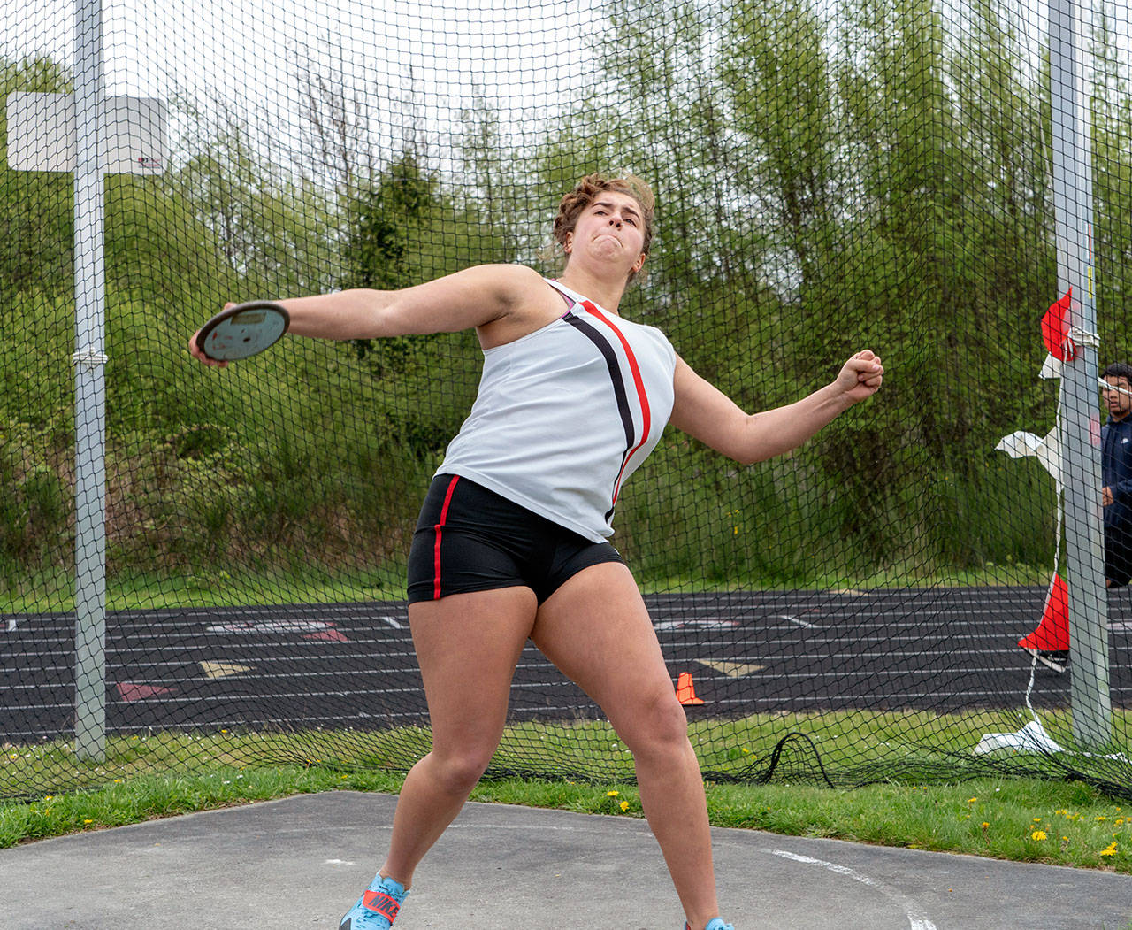 Port Townsends Brenna Franklin throws the discus during a four-school meet at Blue Heron Middle School in Port Townsend on Tuesday.                                Steve Mullensky/for Peninsula Daily News