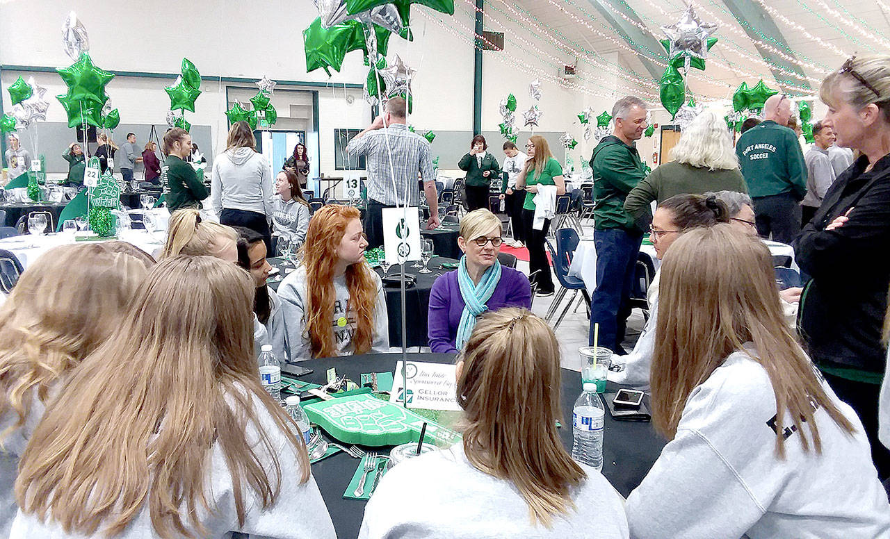 Pierre LaBossiere/Peninsula Daily News Port Angeles Roughrider Hall of Famer Leigh Morgan speaks with the schools girls tennis team at a breakfast held Saturday at the Vern Burton Community Center. Morgan, who was inducted into the hall of fame as an individual last year, is being inducted again this year as a member of the state champion 1985 girls tennis team.