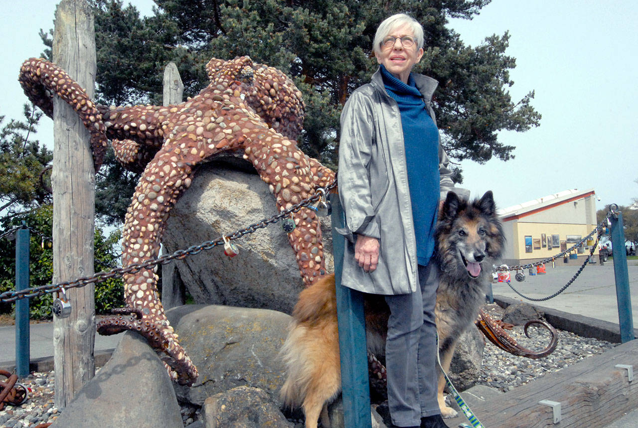 Longtime volunteer and organizer Edna Petersen stands near City Pier with her dog, Preston.(Keith Thorpe/Peninsula Daily News)