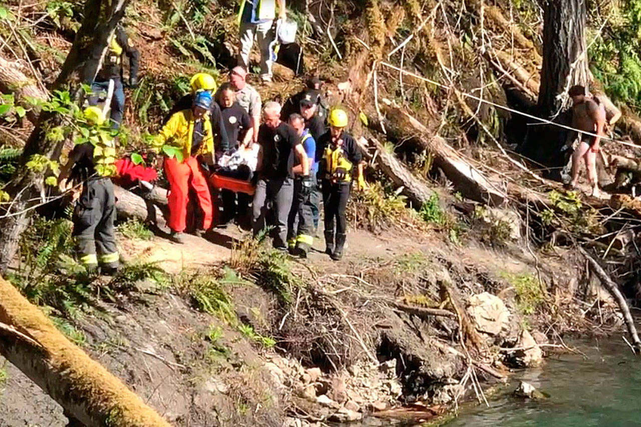 A man who fell in the Elwha River on Sunday is carried to an ambulance. (Clallam Fire District 2)