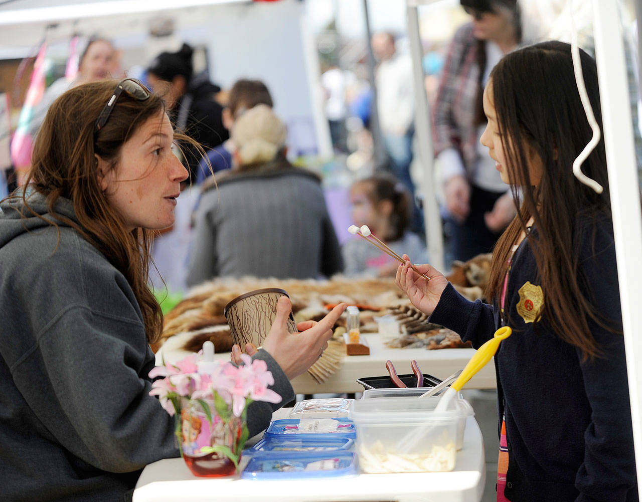 Jenna Ziogas, education coordinator at the Dungeness River Audubon Center, talks about birds’ beaks with Elyse Kim of Sequim at the 2017 Family Fun Day in this file photo. The event will be from 9 a.m. to 4 p.m. on Washington Street on Saturday. (Michael Dashiell/Olympic Peninsula News Group)