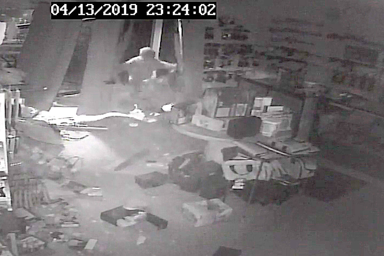 Security footage from the April 13 burglary of FREDS Guns shows a man running into the store before stealing about 30 handguns.