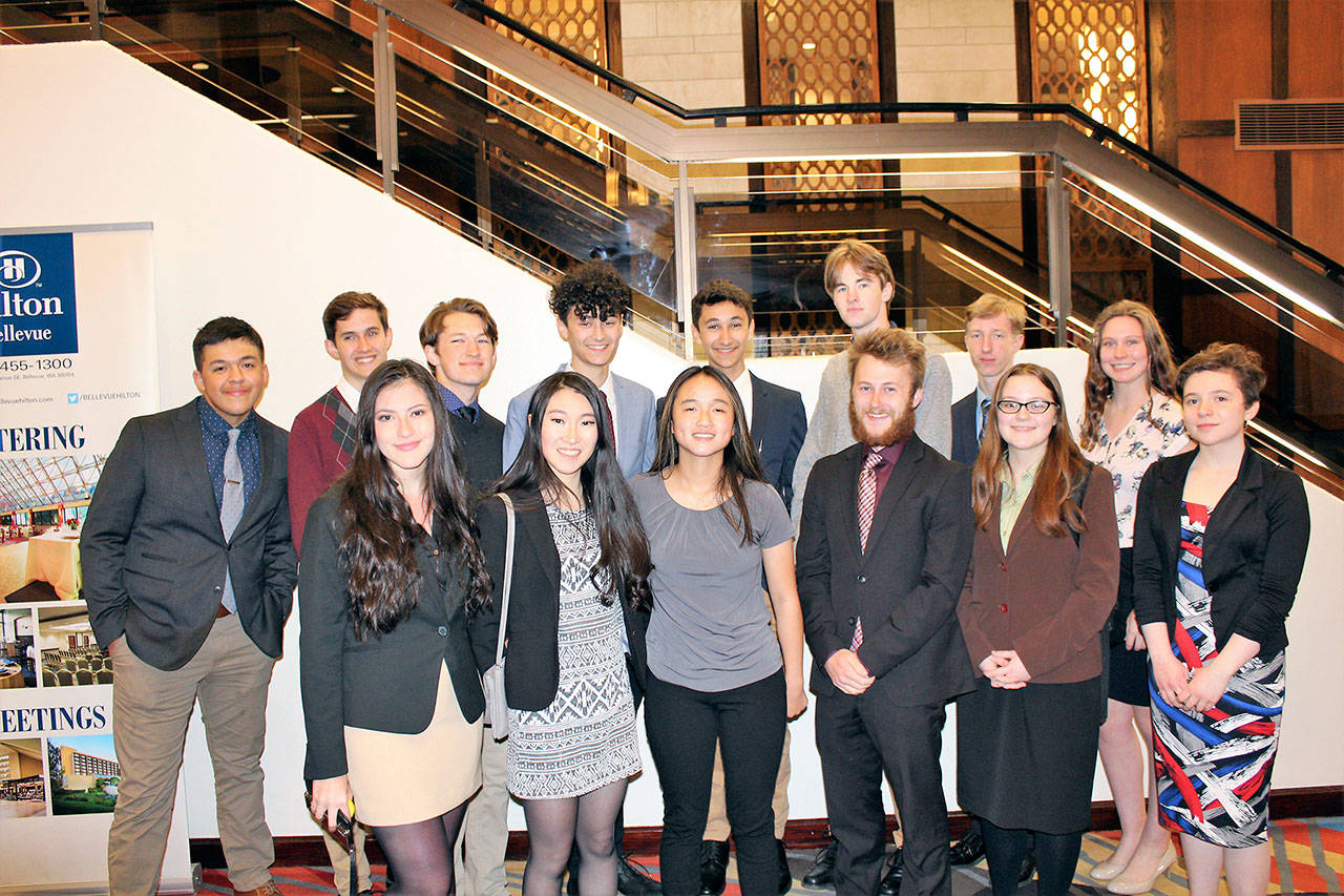 Port Angeles High School students at the Future Business Leaders of America competition in Bellevue, front row, from left, Amelie Atwater, Meiqi Liang, Abby Sanders, Jackie Young, Eva Kirkland and Talia Anderson. Back row, from left Alex Pena, Santi Montal, Hollund Bailey, Mauritz Ahlburg, Leo Ahlburg, Josh Hill, Luke Gavin and Anne Edwards. (Bernie Brabant/Port Angeles School District)