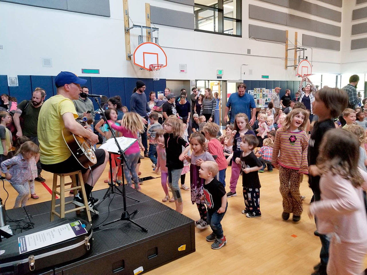 Caspar Babypants performs for children at Salish Coast Elementary School in Port Townsend at a concert to benefit Jefferson Universal Movement Playground. (Sarah Grossman)