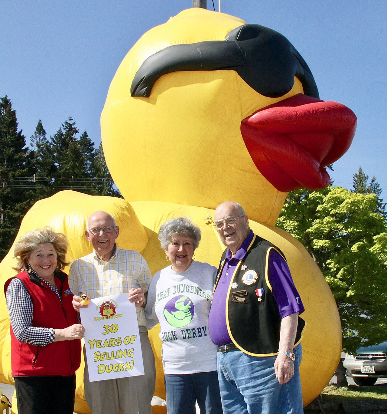 Four people have sold ducks for the Duck Derby for all 30 years of its existence. From left, are Gail Ralston, Dick Kent, Edie Beck and Scooter Chapman at Swain’s General Store recently. (Dave Logan/for Peninsula Daily News)
