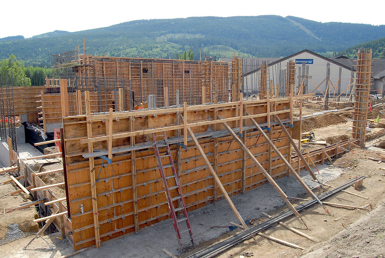 Concrete forms for the first floor of a new resort hotel rise from the ground next to the existing 7 Cedars Casino in Blyn. (Keith Thorpe/Peninsula Daily News)