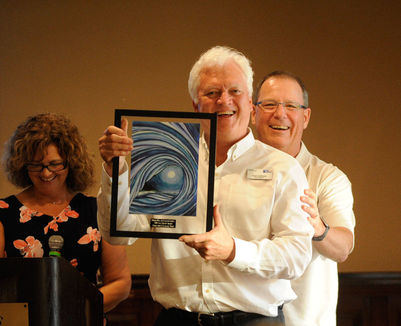 Glenn Smithson, 7 Cedars Casino General Manager, accepts a United Way of Clallam County award at the organization’s annual Campaign Celebration at The Cedars at Dungeness on Thursday. Presenting the award are 2018 campaign chair Lori Taylor and board member/2017 campaign chair Chris Szczepczynski. (Michael Dashiell/Olympic Peninsula News Group)