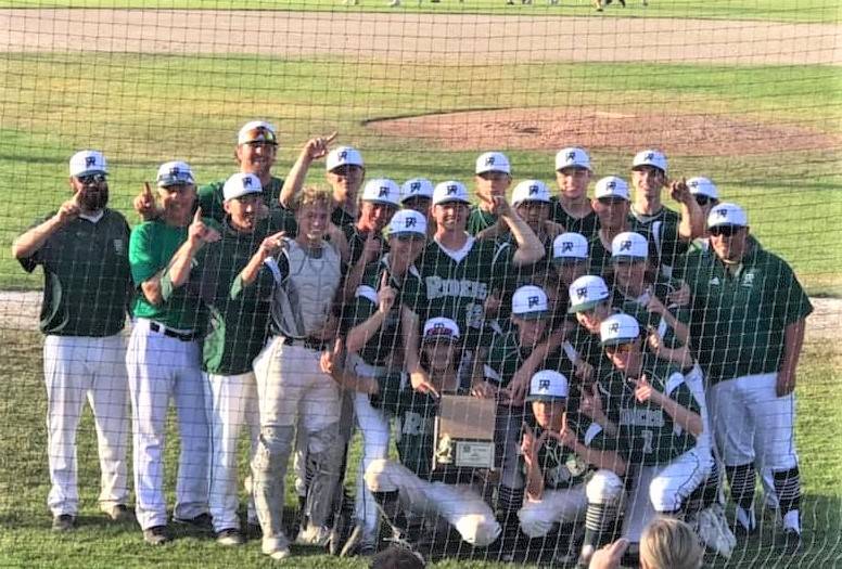 The Port Angeles Roughriders baseball team celebrates winning the West Central District III 2A championship after beating Fife 3-2 in eight innings Saturday night in Tacoma.