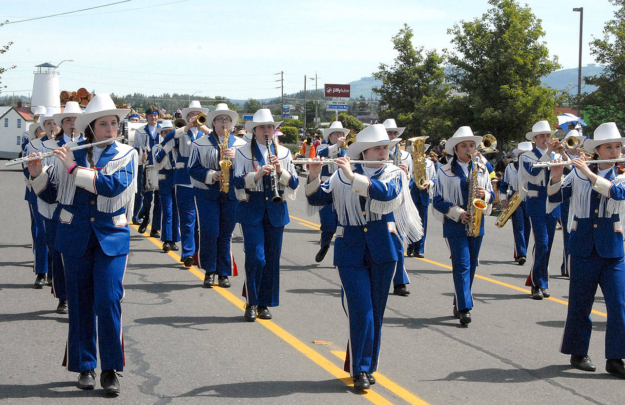 Members of the Chinacum High School marching band perform as they march down Washington Street during Saturday’s Irrigation Festival Grand Parade in Sequim. (Keith Thorpe/Peninsula Daily News)