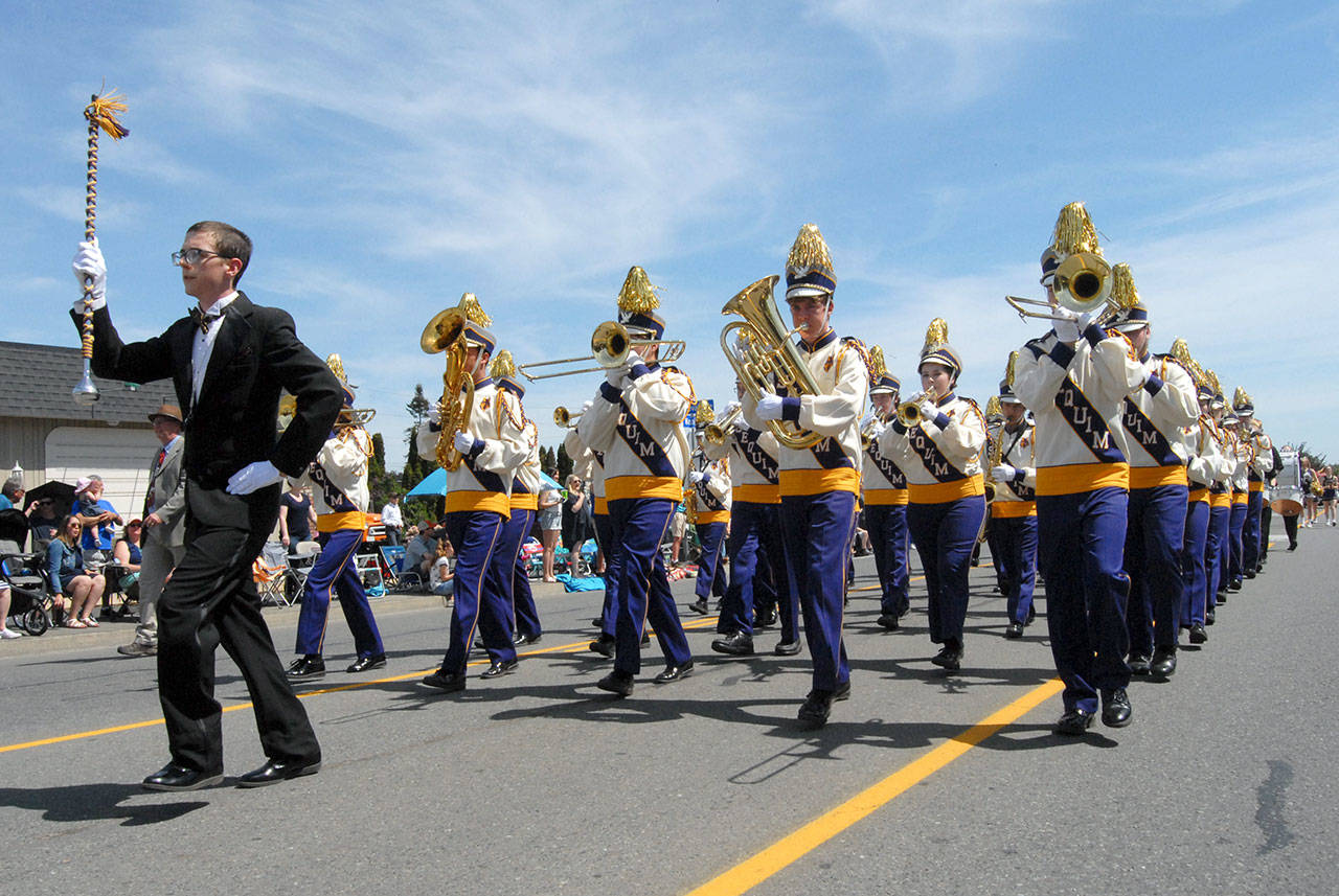 Members of the Sequim High School marching band entertain Grand Parade crowds on Saturday. (Keith Thorpe/Peninsula Daily News)