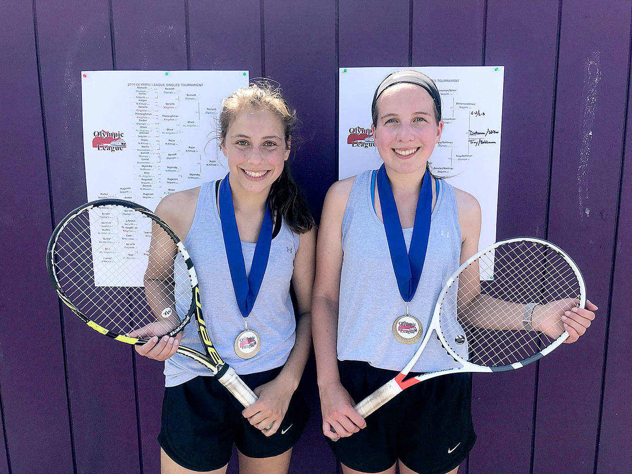 Jessica Dietzman, left, and Kalli Wiker, right, won their second straight Olympic League 2A doubles’ championship this weekend. The Sequim duo won four straight matches en route to the league title in Bremerton.