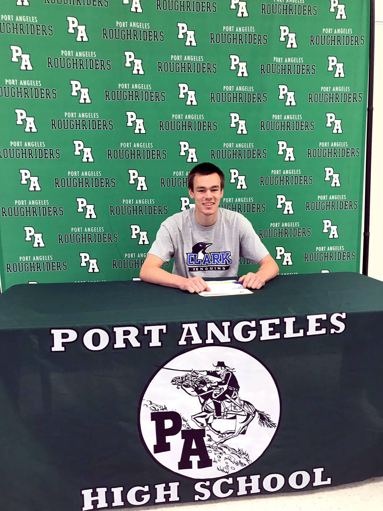 Port Angeles Liam Clark signed a letter of intent Thursday to play basketball at Clark College in Vancouver. Clark also intends to compete in track and field for the Penguins.
