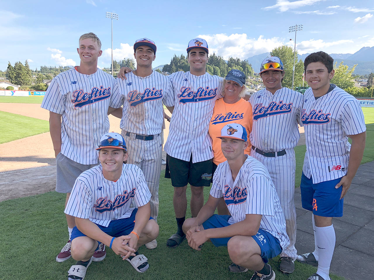 Port Angeles Lefties host family coordinator and host Roxi Baxley (back row, fourth from left) with 2018 Lefties back row, from left, Cameron Allie, Jason Diccochea, Alex Jemal, Baxley, Tristan Hanoian, Avery Santos and front, Tyler Decker and Thomas Rouee.