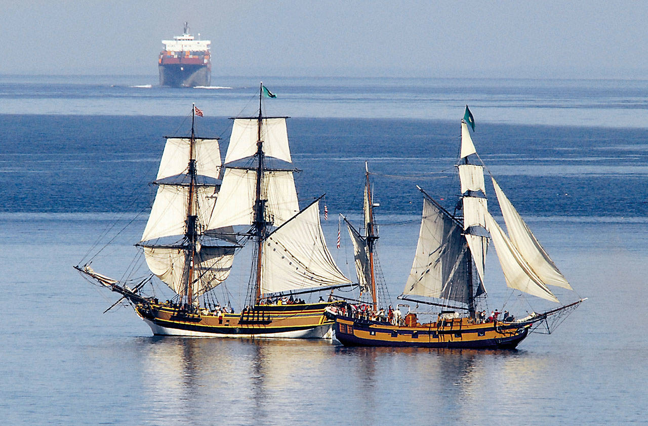 The tall ships Lady Washington, left, and Hawaiian Chieftain pass each other in mock battle in Port Angeles Harbor in this 2010 file photo. (Keith Thorpe/Peninsula Daily News)
