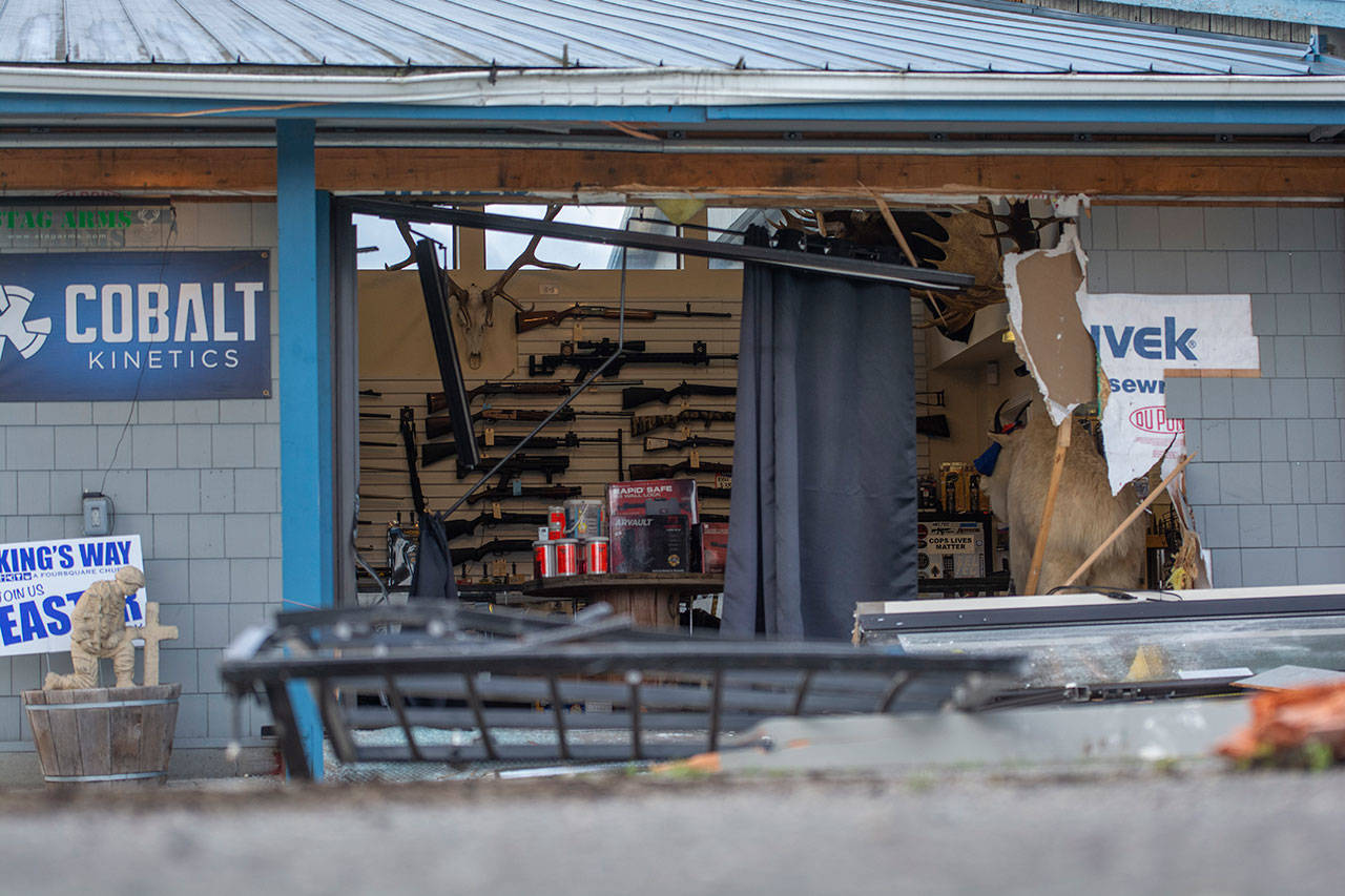 Heavy equipment was used to break into FREDS Guns in April, causing the damage seen here in this file photo. (Jesse Major/Peninsula Daily News)