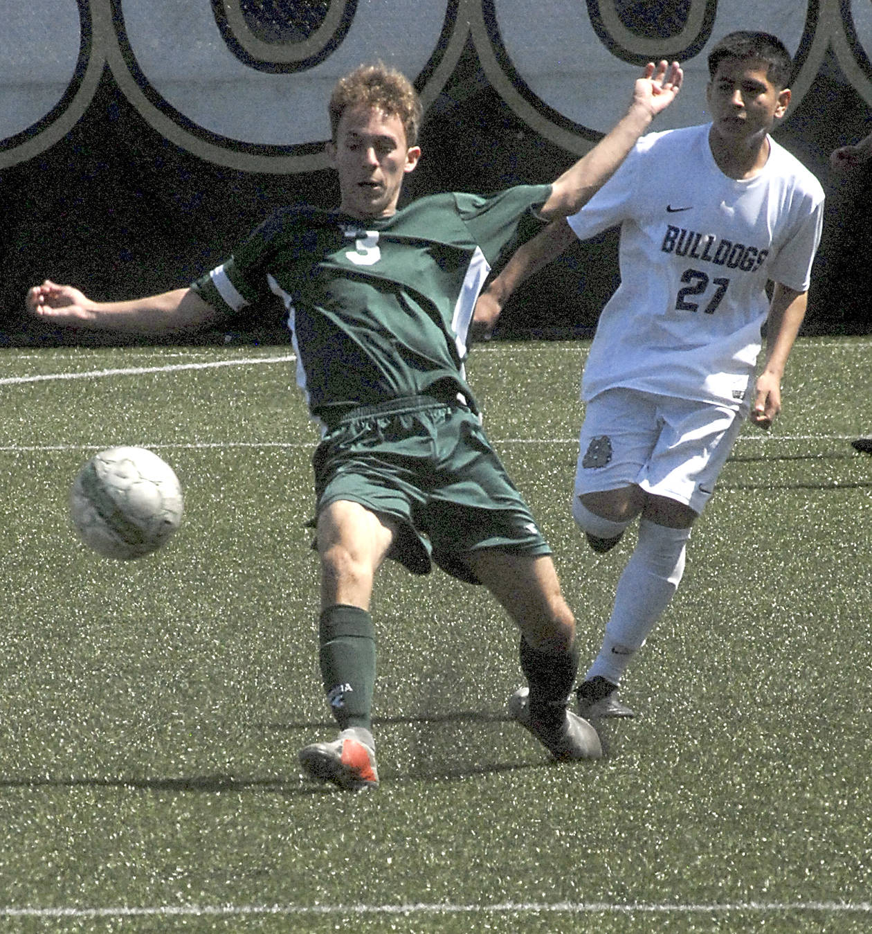 <strong>Keith Thorpe</strong>/Peninsula Daily News                                Port Angeles’ Andrew St. George passes the ball during a district playoff game earlier this month.