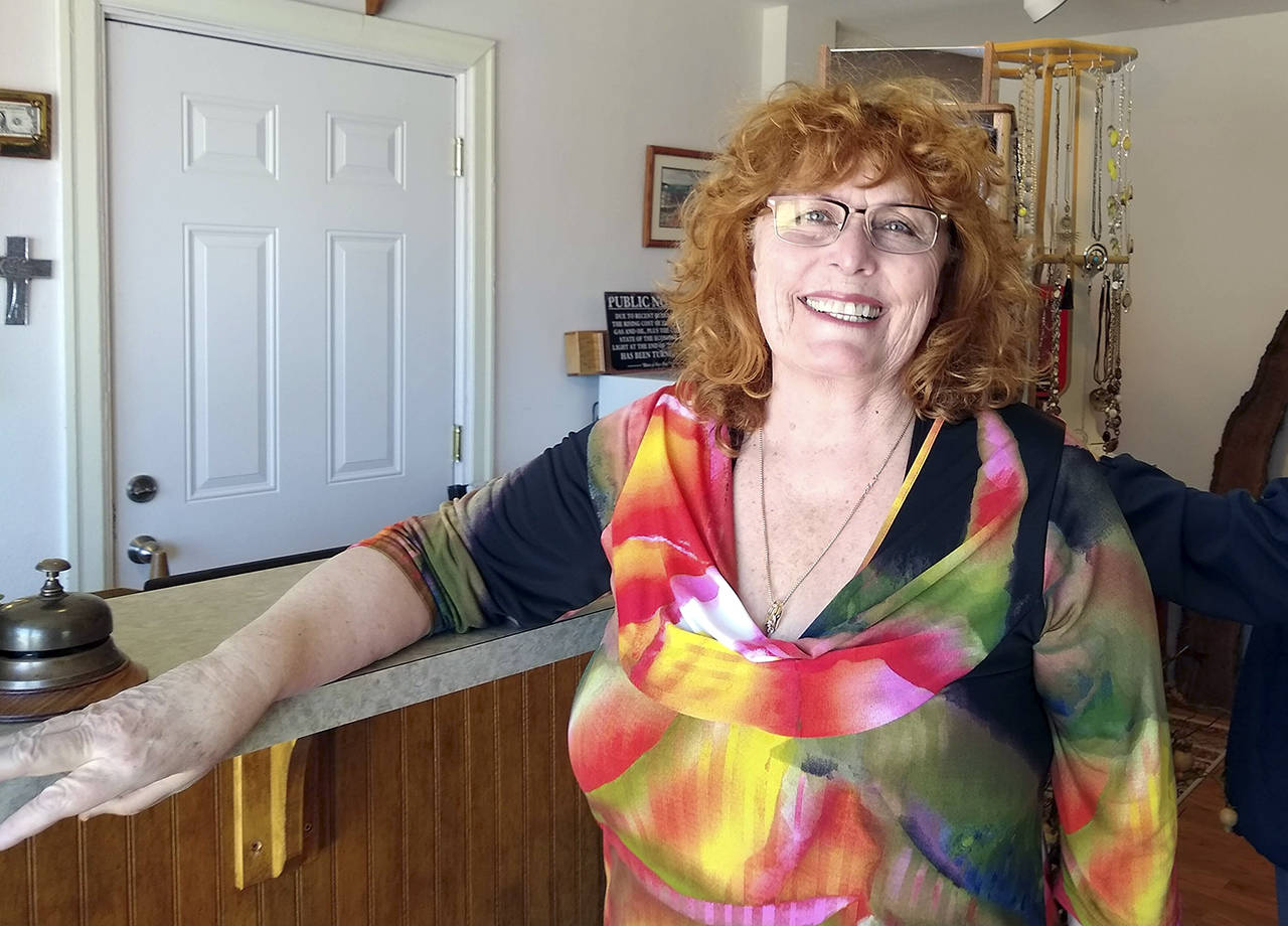 Jeanette Gossard is shown in the Bees Knees Boutique in Port Angeles. (Denise Buchner/Peninsula Daily News)