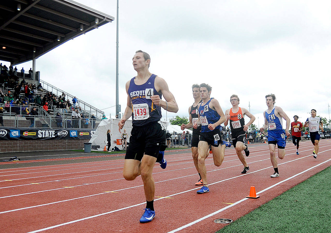 Sequim’s Murray Bingham, left, leads the 800-meter race Saturday at Mount Tahoma High School in Tacoma at the state 2A Track and Field Championships. Bingham went on to win the race. (Michael Dashiell/Olympic Peninsula News Group)