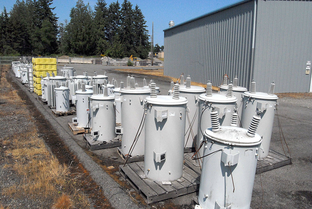 Electric power transformers sit in the Port Angeles public utility storage yard on Lauridsen Boulevard near the site of a proposed City Light building for electrical equipment. (Keith Thorpe/Peninsula Daily News)