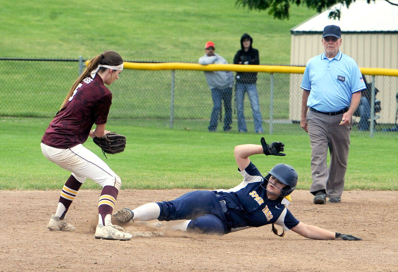 Lonnie Archibald/for Peninsula Daily News Forks’ Rian Peters steals second base ahead of the tag by Cle Elum-Roslyn’s Katelyn Ness.