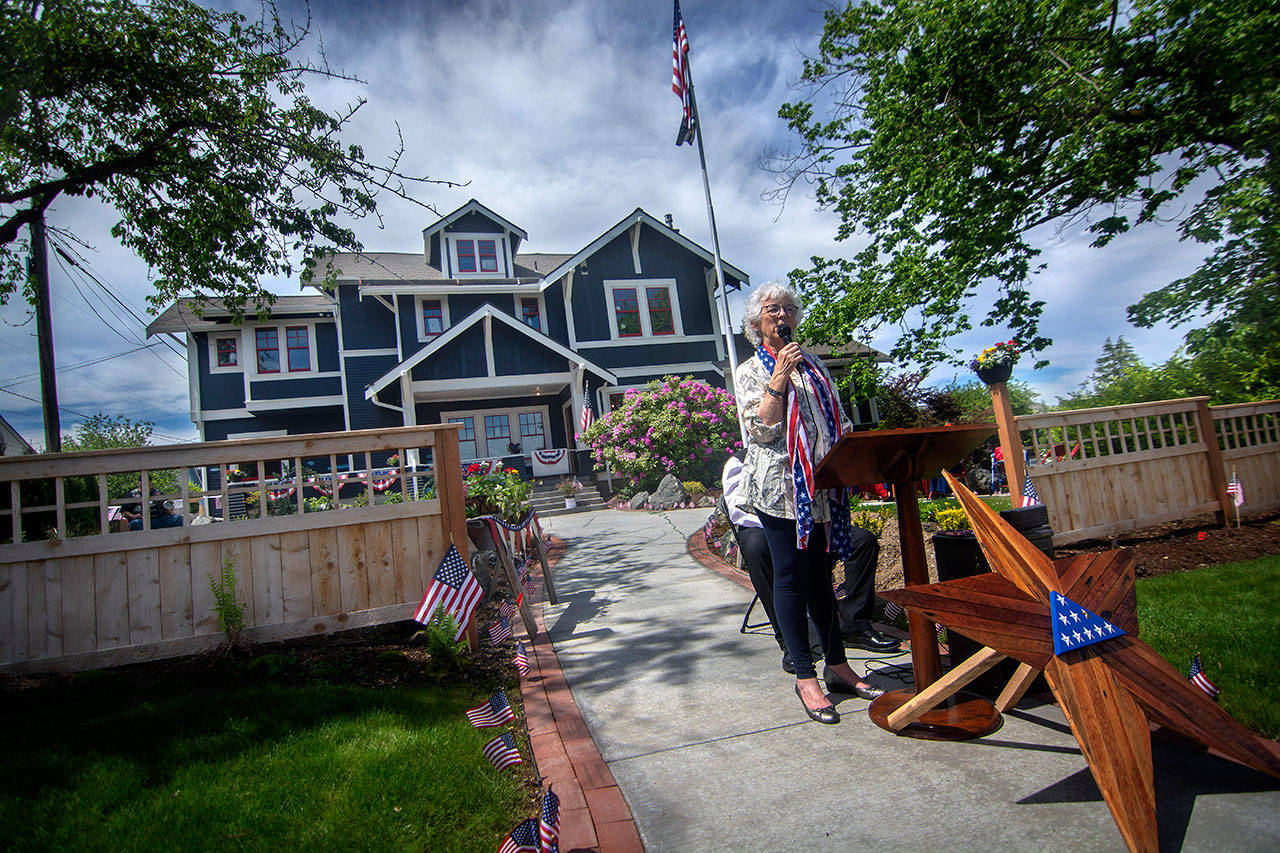Betsy Reed Schultz, founder of Captain Joseph House in Port Angeles, thanks those who attended the memorial service at Captain Joseph House on Sunday. (Jesse Major/Peninsula Daily News)
