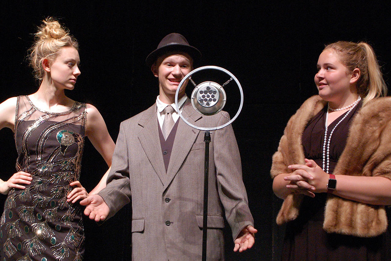 Lina Lamont and Don Lockwood (Mia Coffman and Dean Rynearson), from left, respond to questions from Dora Bailey (Cadence Puhrmann) during a rehearsal of the Olympic Peninsula Academy’s production of “Singin’ In The Rain Jr.” (Conor Dowley/Olympic Peninsula News Group)