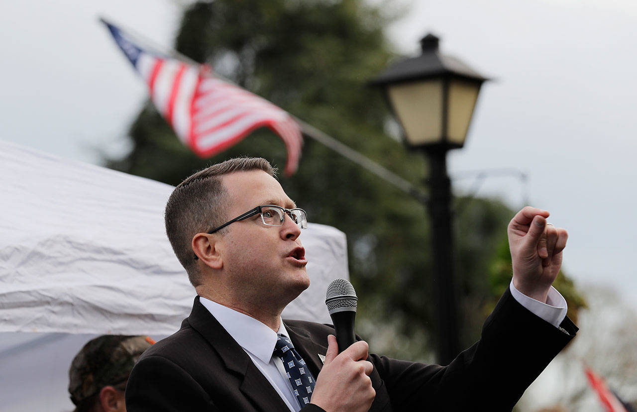 State Rep. Matt Shea, R-Spokane Valley, speaks at a gun-rights rally Jan. 18 at the Capitol in Olympia. (Ted S. Warren/The Associated Press)